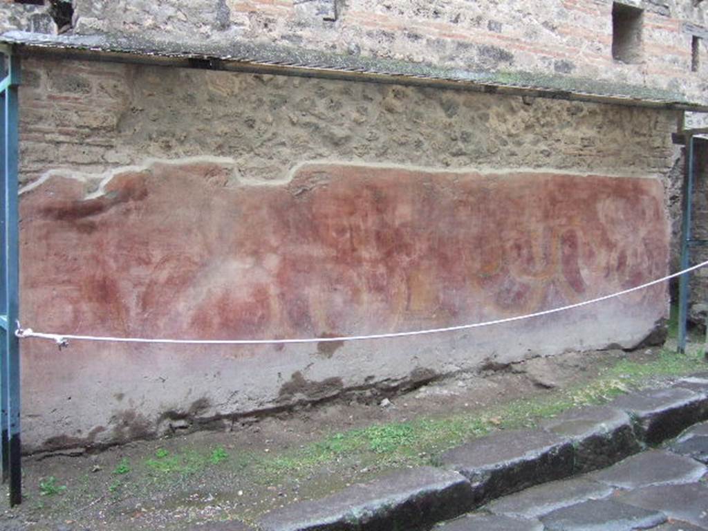 VII.11.13 Pompeii. December 2005. Painted street shrine on outside wall.  In the past in white letters above the painting were the words 
Otiosis locus hic non est. Discede morator.    [CIL IV 813].
“This is not the place to idle, Shove off, loiterer”. (Translation by P. Foss). See Dobbins, J & Foss, P., 2008. The World of Pompeii. New York: Routledge. (p.482 and Note 81).

According to Epigraphik-Datenbank Clauss/Slaby (See www.manfredclauss.de) this read
Otiosis locus
hic non est discede
morator      [CIL IV 813].