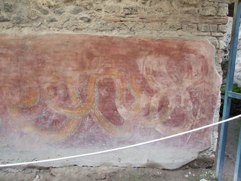 VII.11.13 Pompeii. December 2005. Painted street shrine on outside wall at north end.   
According to Fiorelli, on the extreme right of the painting, written in white, but now completely vanished, was a record of wine drunk in the caupona, and above that was written -    
L(V)MPAS 
      ROMANESES
See Pappalardo, U., 2001. La Descrizione di Pompei per Giuseppe Fiorelli (1875). Napoli: Massa Editore. (p.110)

According to Epigraphik-Datenbank Clauss/Slaby (See www.manfredclauss.de) this read

L[u]mpas
Romane(n)ses       [CIL IV 815]
