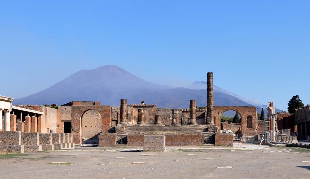 Forum looking north. July 2017.
The remaining arch, attributed to Augustus, is still standing on the west side of the Temple of Jupiter/Giove, on left.
On the right, on the east side of the Forum, is the Forum Arch in the North-East corner, at the rear of the Temple. 
Foto Anne Kleineberg, ERC Grant 681269 DCOR.
