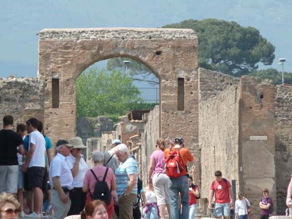 Arch of Caligula. May 2010. Looking north from Via Foro.