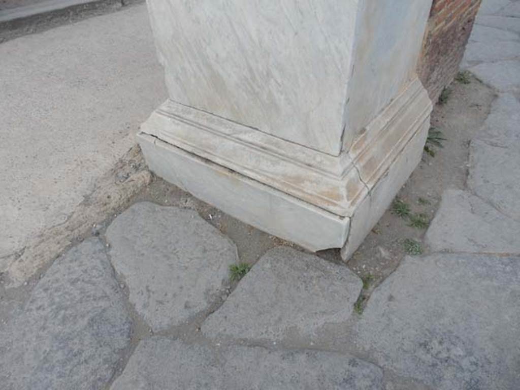 Arch of Marcus Holconius Rufus. May 2017. Detail of marble veneer on north-west pillar, west and south side. Photo courtesy of Buzz Ferebee. 
