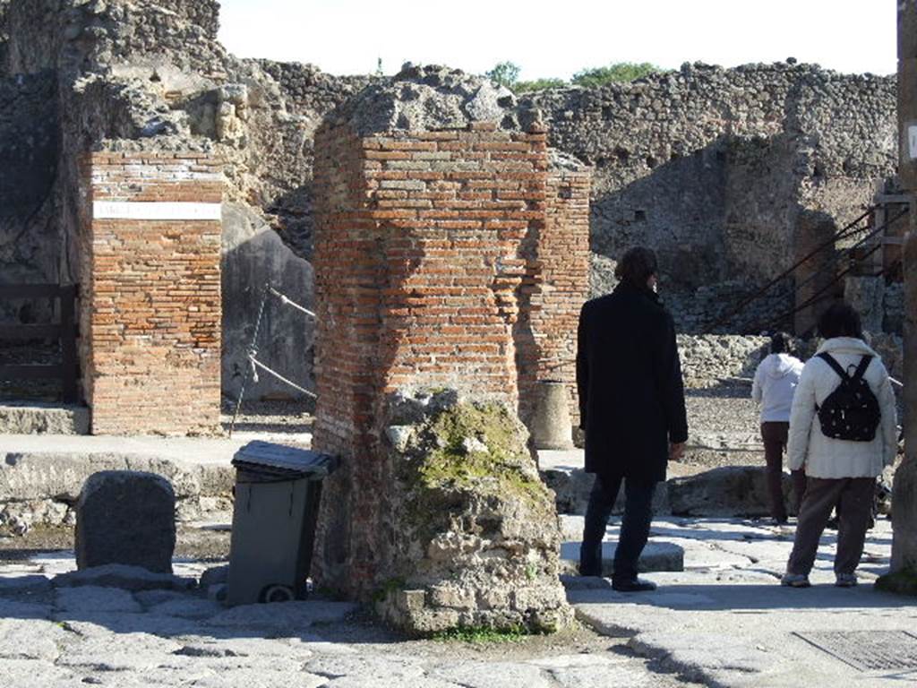 Arch of Marcus Holconius Rufus. December 2006. South east pillar with remains of a statue base. One of the four pillars supporting the arch.