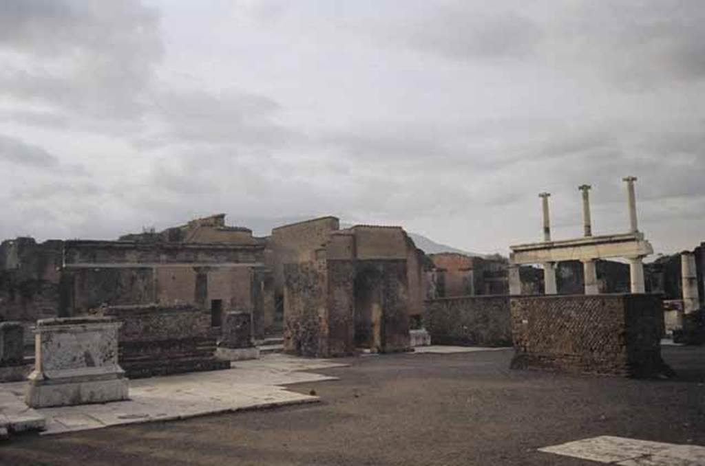 Arched monument at south end of Forum. January 2009. Photo courtesy of Rick Bauer. According to Mau, the four monuments arranged in a group, with the arched monument at the centre, were for the imperial family.