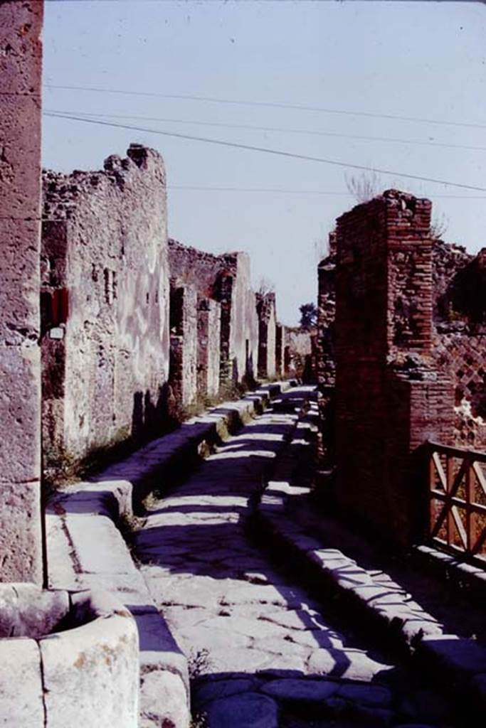 Fountain outside VII.4.32 on Via degli Augustali. 1978. Vicolo Storto between VII.4 and VII.2. 
Looking north from junction with Via degli Augustali. Photo by Stanley A. Jashemski.
Source: The Wilhelmina and Stanley A. Jashemski archive in the University of Maryland Library, Special Collections (See collection page) and made available under the Creative Commons Attribution-Non Commercial License v.4. See Licence and use details.
J78f0571

