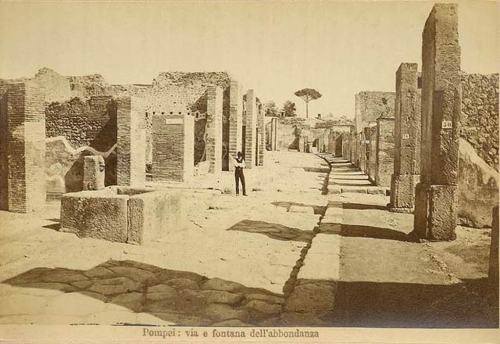 Fountain outside VII.14.13 and VII.14.14 on Via dellAbbondanza. C.1880s. Looking east from near fountain.
In the distance is the as-yet-unexcavated area near Holconius crossroads. Photo courtesy of Rick Bauer.

