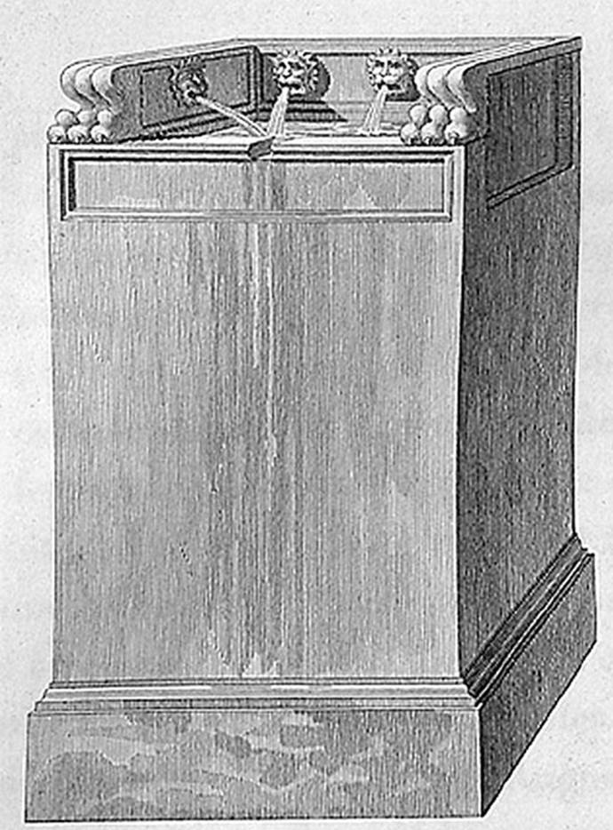 1824 drawing of fountain base with four lions heads.
According to Mazois this was placed in the camp of soldiers when he drew it. 
It was a graceful composition and had to belong to some private building.
It was removed in 1810.
See Mazois, F., 1824. Les Ruines de Pompei: Second Partie. Paris: Firmin Didot. (p. 37 Plate III, Fig II).
According to Eschebach the remains of this fountain were removed in 1810 and have not been found again.
See Eschebach, H., 1983. Pompeii, Herculaneum, Stabiae; Bollettino dellAssociazione Internazionale Amici di Pompei 1.  (p. 30, fig 40).
