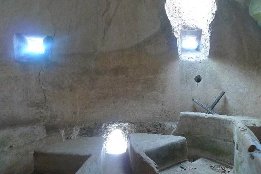 Castellum Aquae Pompeii. July 2010. Three channel water divider. 
The two front windows above are wider on the inside than they are on the outside. 
