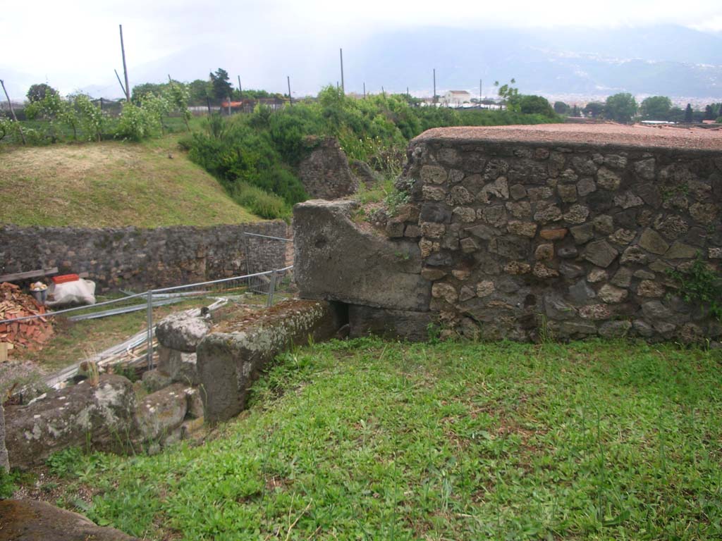 Vesuvian Gate, Pompeii. May 2010. 
Looking south-east on upper area towards upper west wall of gate, in centre, and rear wall of Castellum Aquae, on right. 
Photo courtesy of Ivo van der Graaff.
