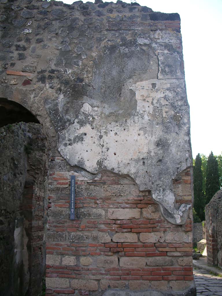 Porta Ercolano or Herculaneum Gate, Pompeii. May 2010. 
Looking north towards remaining stucco on upper west side of gate.  Photo courtesy of Ivo van der Graaff.
