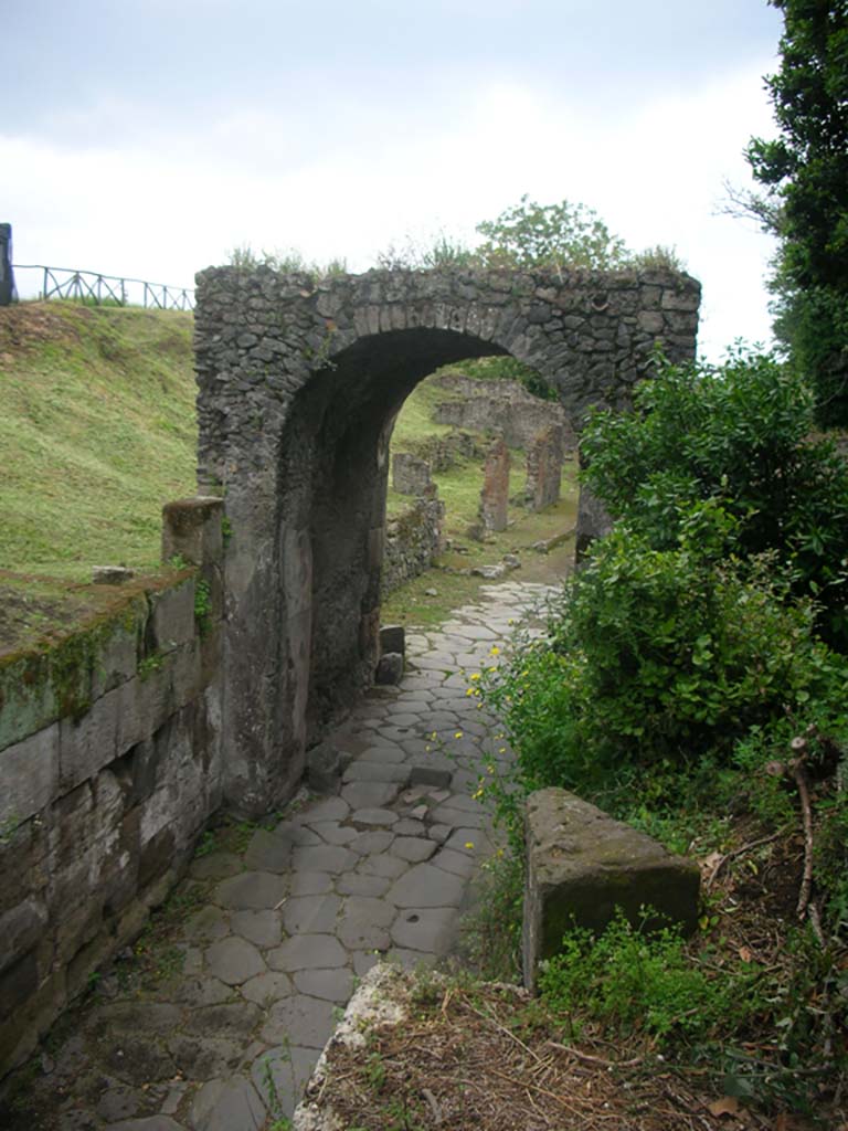 Nola Gate, Pompeii. May 2010. 
Looking west through gate towards Via di Nola, from upper north side. Photo courtesy of Ivo van der Graaff.

