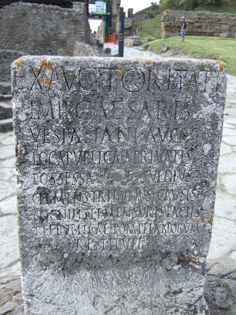 Pompeii Porta Nocera. Cippus of Titus Suedius Clemens. The Cippus is inscribed:

Ex auctoritate 
imp(eratoris) Caesaris 
Vespasiani Aug(usti)
loca publica, a privatis
possessa T(itus) Suedius 
Clemens tribunus causis c
ognitis et mensuris factis 
rei publicae Pompeianorum 
restituit,  

By virtue of authority conferred upon him by the Emperor Vespasian Caesar Augustus, Titus Suedius Clemens, tribune, having investigated the facts and taken measurements, restored to the citizens of Pompeii public places illegally appropriated by private persons. Similar Cippi were found at the Porta Ercolano, Porta Marina and the Porta Vesuvio. The wording “rei publicae Pompeianorum” on one of these, discovered in 1763, was the first positive identification that the site was Pompeii. Until then scholars had divided opinions on the city buried under Civita.  Many, including the first official excavators, thought it was the ancient city of Stabiae. See Conticello, B., Ed, 1990. Rediscovering Pompeii. Rome: L’Erma di Bretschneider. (p. 225).