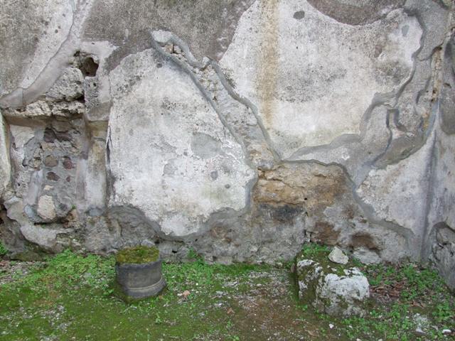 IX.8.7 Pompeii. March 2009. South wall, with stone base of stairs, and line of stairs visible in the plaster.
According to Boyce, on the south wall beneath the stairs leading to the upper floor, a panel (h.0.95, w.1.10) of white stucco was bordered with red stripes.
On this panel was painted a single serpent, advancing left towards a burning altar, which stood amongst plants.
See Notizie degli Scavi di Antichità, 1880, 98.
See Boyce G. K., 1937. Corpus of the Lararia of Pompeii. Rome: MAAR 14. (p.90, no.450) 

