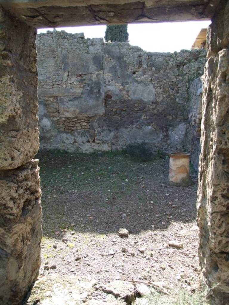 IX.9.11 Pompeii.  March 2009.  Room 6. Garden area.  South wall and south west corner, with remains of Lararium painting.
