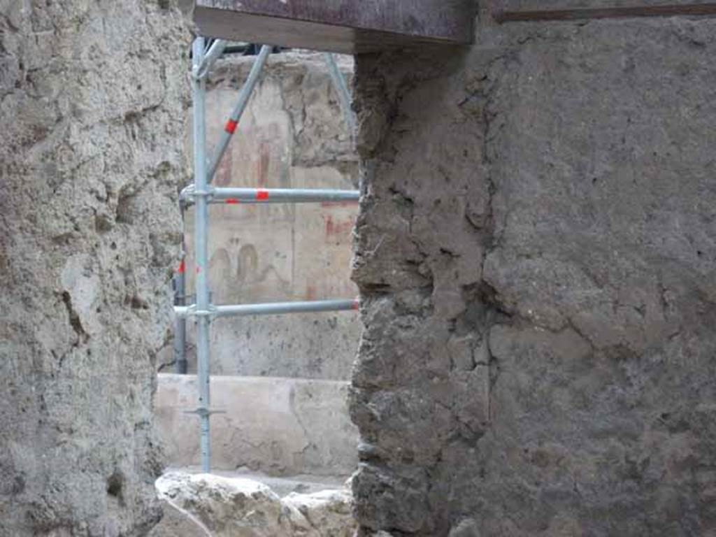 IX.12.6 Pompeii. February 2017. 
Room 6, looking south along west wall towards lararium with altar below. Photo courtesy of Johannes Eber.
