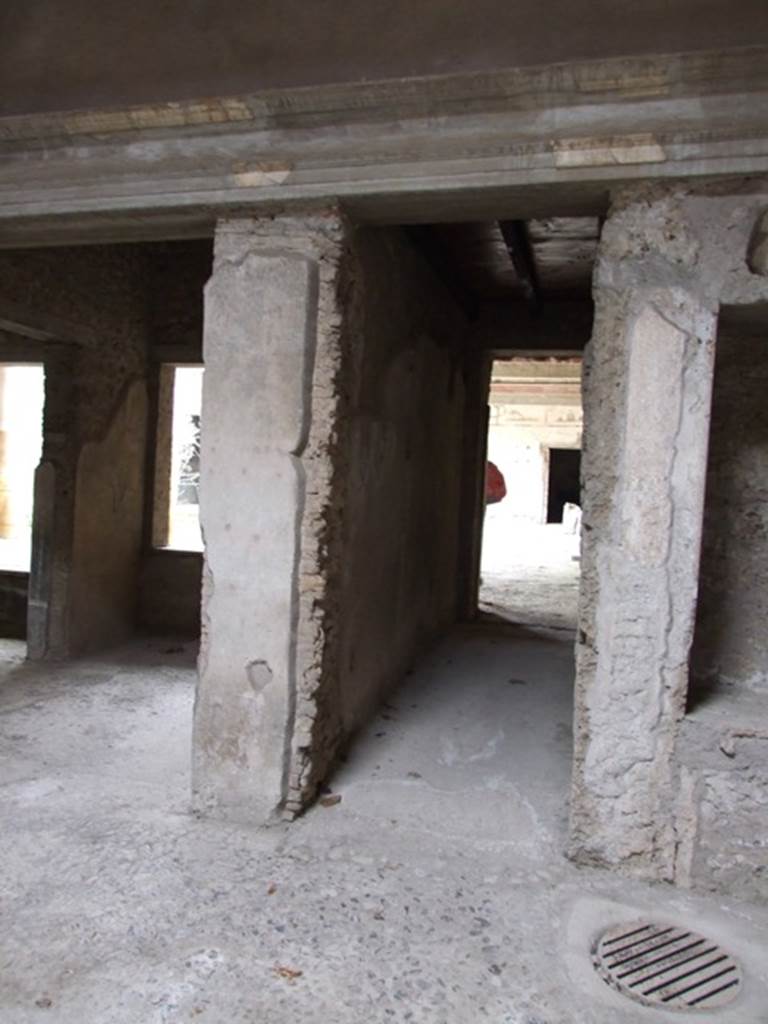 IX.13.1-3 Pompeii. March 2009. Room 2, north-east corner of atrium. 
Recess with 2 niches.
