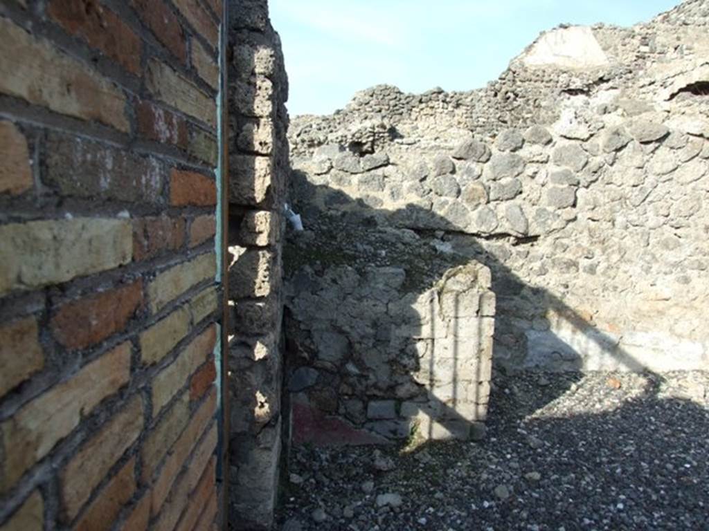 I.3.3 Pompeii. December 2007. North-west corner of atrium.
According to Boyce –
In the north-west corner of the atrium stood a structure described by Fiorelli as “un ara de’ sacrifizi”, by Mau as “una tavola di materiale”.
There remains today a large masonry podium (1.0 by 1.10, h. about 1.0) which looked like the base of an aedicula, according to Boyce.
See Boyce G. K., 1937. Corpus of the Lararia of Pompeii. Rome: MAAR 14. (p.24, no.19). 


