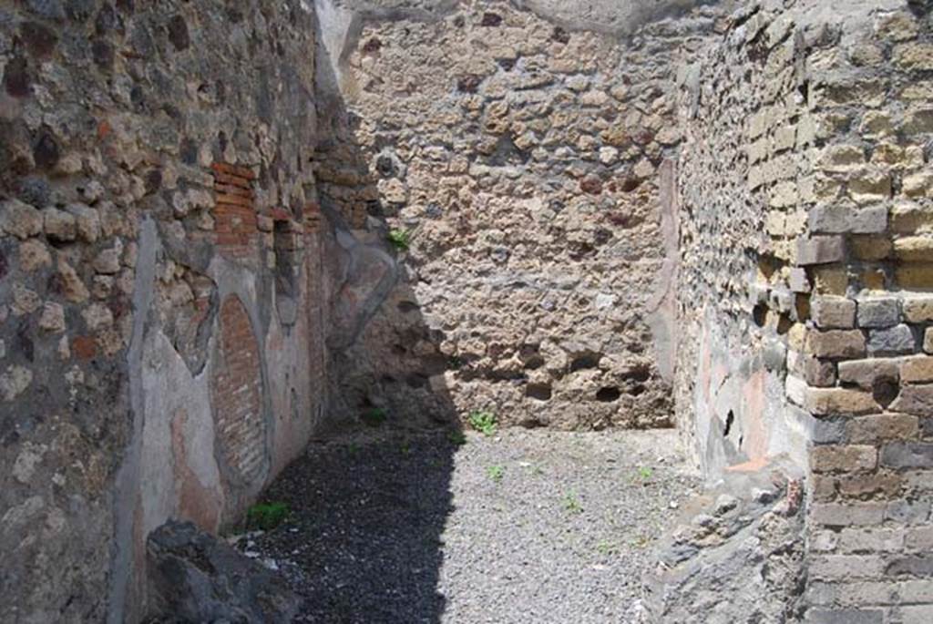 VI.3.20 Pompeii. May 2003. Niche in west wall of rear room. Photo courtesy of Nicolas Monteix
According to Boyce –
In the west wall of the rear room is a rectangular niche (h.0.50, w. 0.38, d.025, h. above floor 1.15), its walls coated with red stucco.
See Boyce G. K., 1937. Corpus of the Lararia of Pompeii. Rome: MAAR 14, (p.45, no.147).

