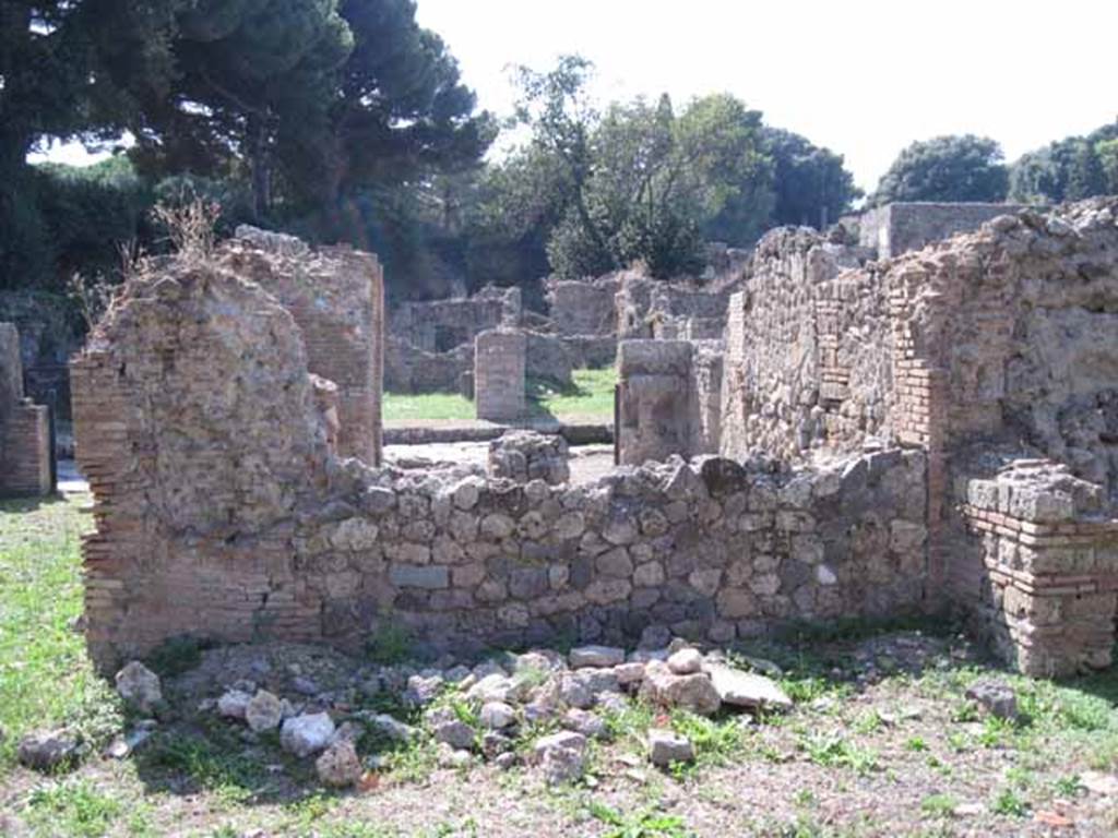 I.1.3 Pompeii. September 2010. West wall of yard area, behind rear room of I.1.4. Photo courtesy of Drew Baker.
