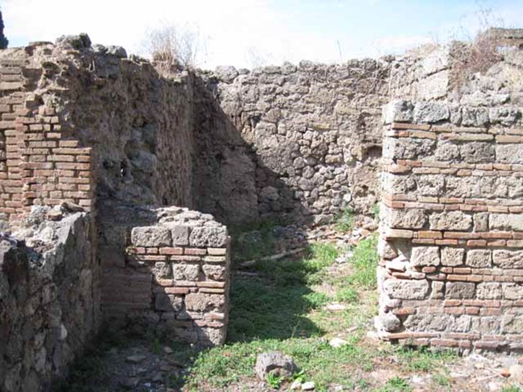 I.1.3 Pompeii. September 2010. Looking north through doorway of room in north-west corner of yard area. Photo courtesy of Drew Baker.
