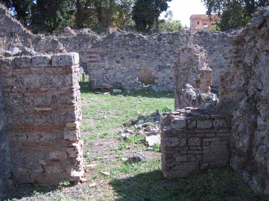 I.1.3 Pompeii. September 2010. Doorway from small room, looking south across yard area. Photo courtesy of Drew Baker.
