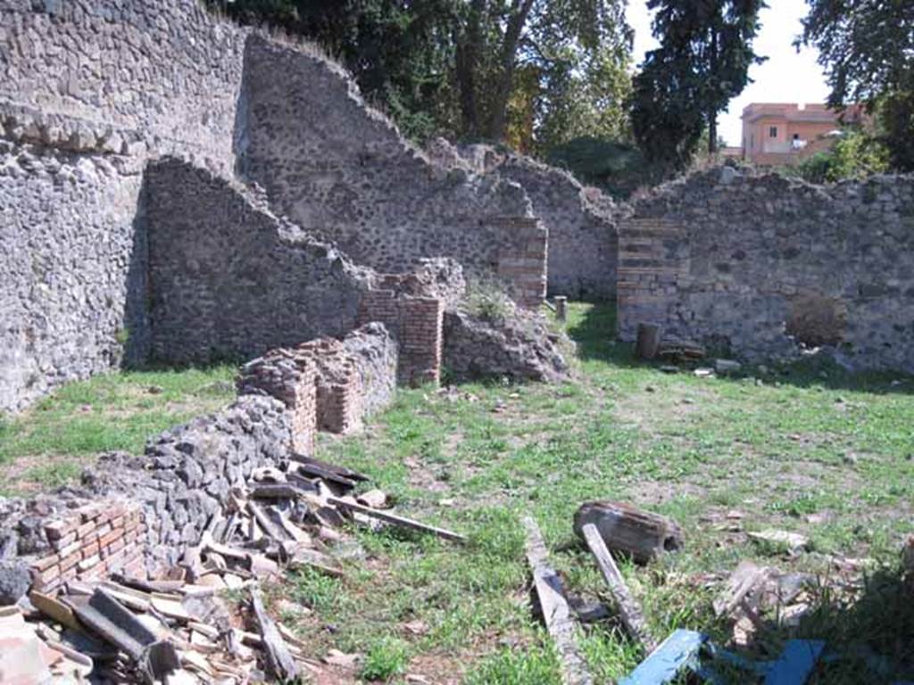 I.1.3 Pompeii. September 2010. Rear area of yard and stables, looking south to doorway to second stables area behind I.1.2. Photo courtesy of Drew Baker.
