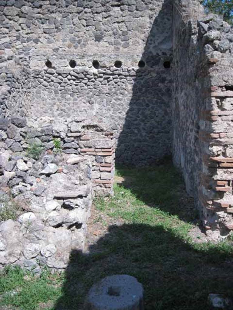 I.1.3 Pompeii. September 2010. Looking east towards doorway to kitchen, in south-east corner of first yard area. Photo courtesy of Drew Baker.
