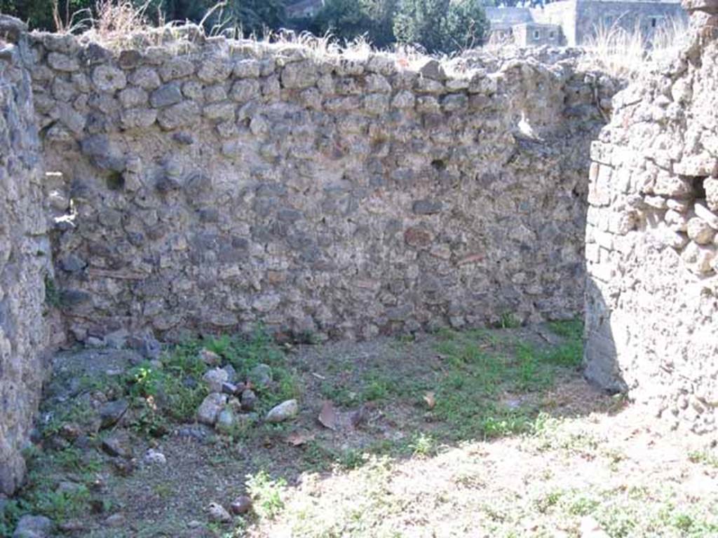 I.1.3 Pompeii. September 2010. West wall of room, with doorway in north-west corner. Photo courtesy of Drew Baker.
