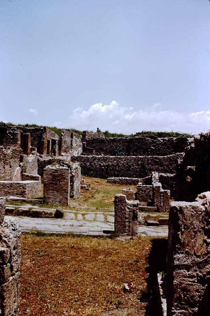 I.1.8 Pompeii. 1966. 
Looking across the Via Stabiana, from rear of VIII.7.8, towards the ramp of the entrance doorway.
Photo by Stanley A. Jashemski.
Source: The Wilhelmina and Stanley A. Jashemski archive in the University of Maryland Library, Special Collections (See collection page) and made available under the Creative Commons Attribution-Non-Commercial License v.4. See Licence and use details.
J66f0200
