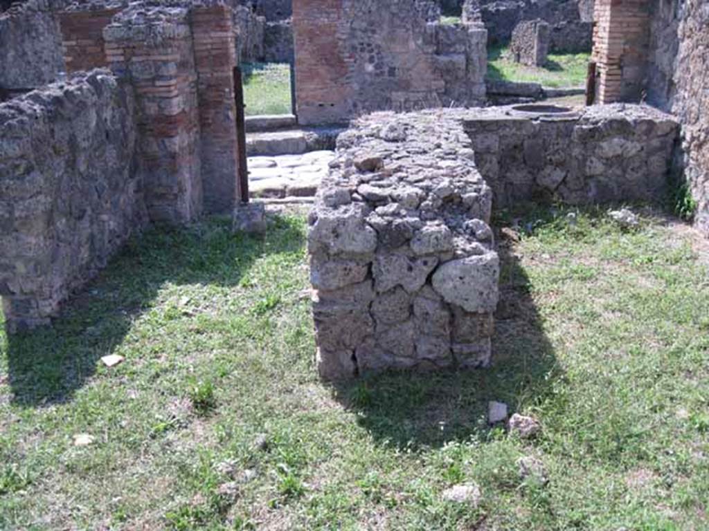 I.1.9 Pompeii. September 2010. Looking west across bar-room towards rear of counter. Photo courtesy of Drew Baker.
