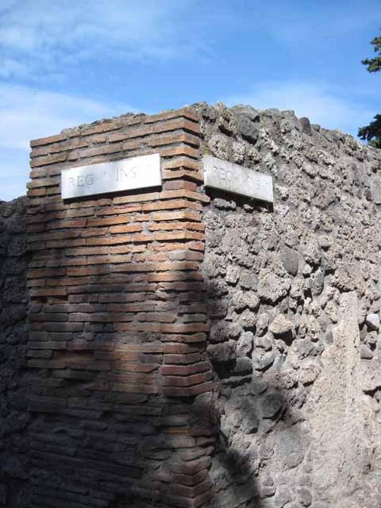 I.1.1 and I.1.10 Pompeii. September 2010. ID Plate (corner of Via Stabiana and unnamed vicolo between I and city walls). Photo courtesy of Drew Baker.
