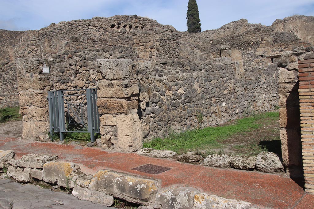 I.2.5 Pompeii, on right. October 2024. 
Looking north-east from Via Stabiana towards entrance doorway, with doorway to I.2.6, on left. Photo courtesy of Klaus Heese.
