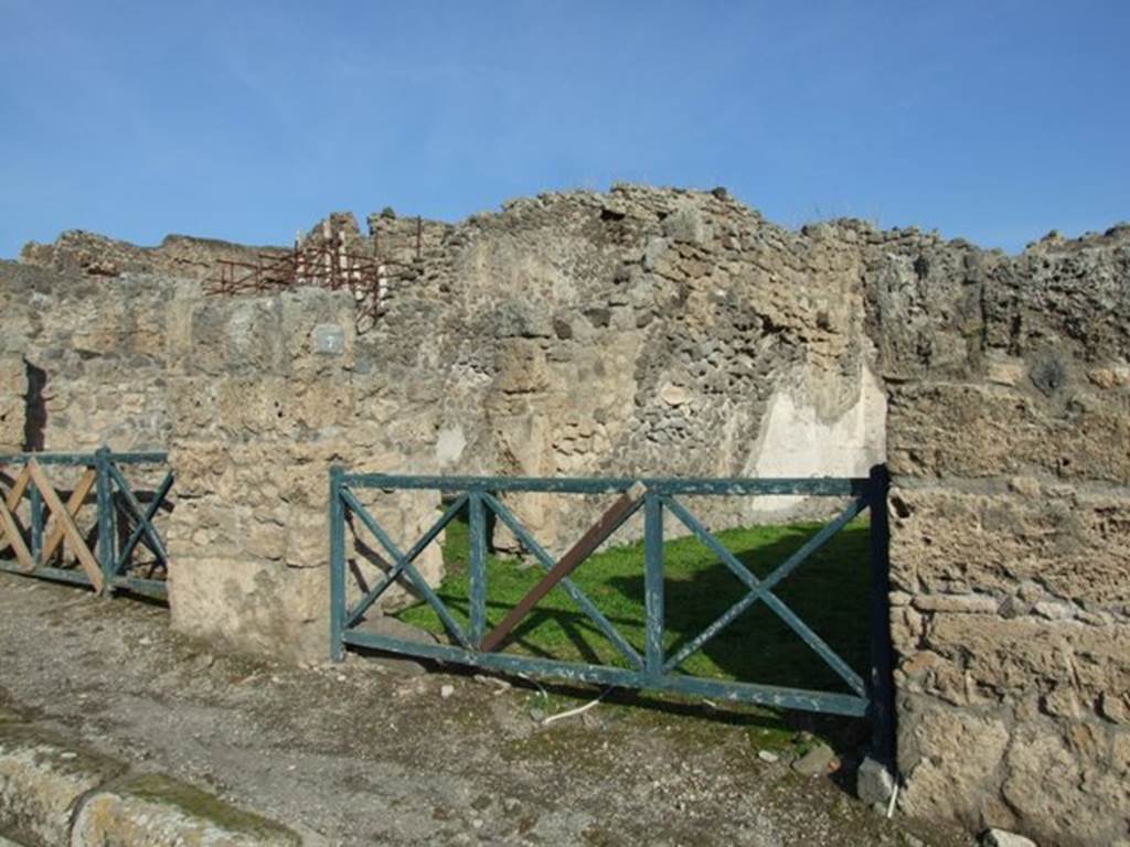 I.2.7 Pompeii. December 2007. Entrance doorway and north wall of shop.