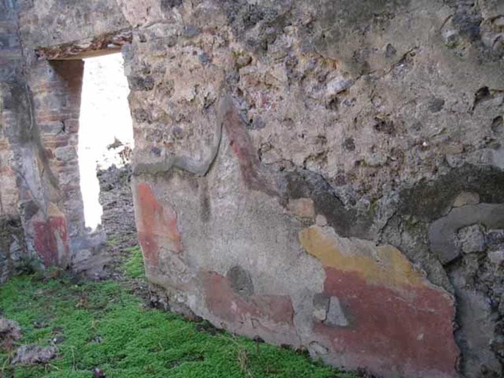 I.2.10 Pompeii. September 2010. 
South wall of triclinium, with doorway into corridor in south-east corner, on left. Photo courtesy of Drew Baker.
This wall used to show a painting of Bacchus, with cantharus and panther. 
According to Sogliano this had nearly disappeared when excavated.
See BDI ,1874, p.198.
See Sogliano, A., 1879. Le pitture murali campane scoverte negli anni 1867-79. Napoli: (p.38, no.160, described as young Dionysus).
According to Kuivalainen this was damaged when discovered and had disappeared by 1875.
It was described as Bacchus pouring wine from a cantharus to a panther.
See Kuivalainen, I., 2021. The Portrayal of Pompeian Bacchus. Commentationes Humanarum Litterarum 140. Helsinki: Finnish Society of Sciences and Letters, (p.107, C2).
