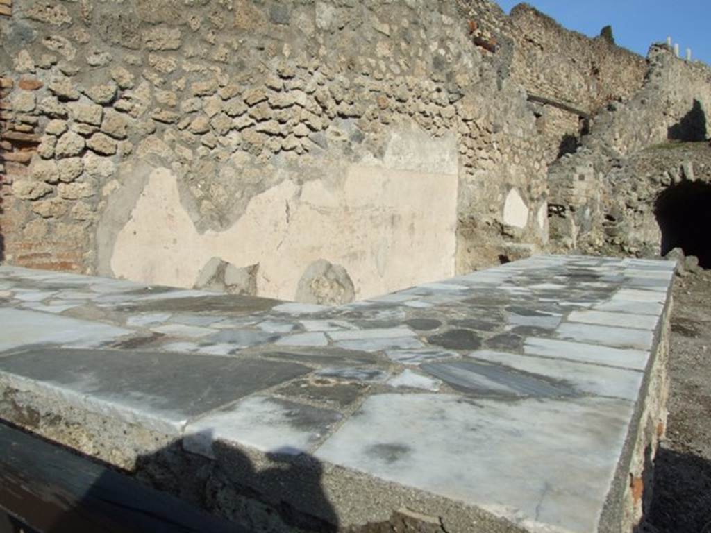 I.2.13 Pompeii. December 2007. North wall and reconstructed serving counter.