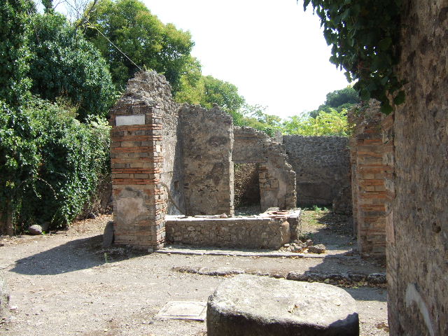I.2.18 Pompeii. September 2015. Looking south towards collapsed wall and rear room in bar.