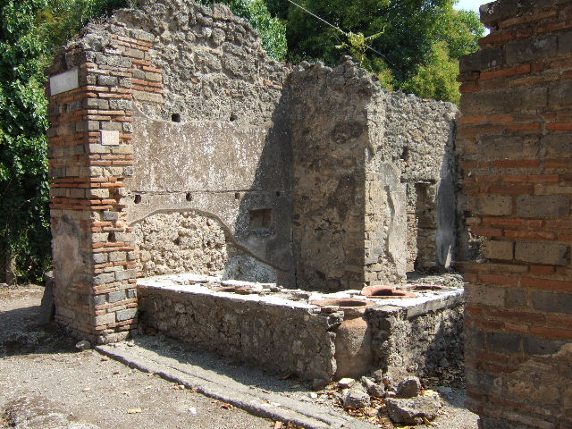 I.2.18 Pompeii. May 2003. Counter with urns. Photo courtesy of Nicolas Monteix.

