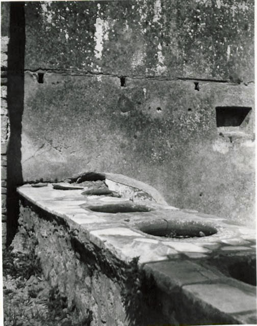 I.2.18 Pompeii.  March 2009.  Counter with urns and hearth, taken from doorway into I.2.17.