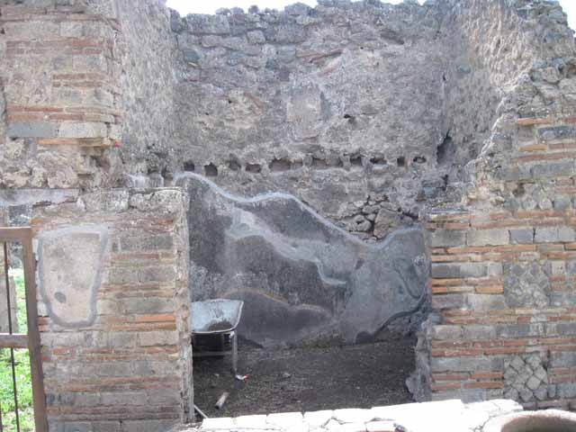 I.2.18 Pompeii. September 2010. Looking west from rear of bar counter, towards doorway to peristyle garden of I.2.17. Photo courtesy of Drew Baker.
