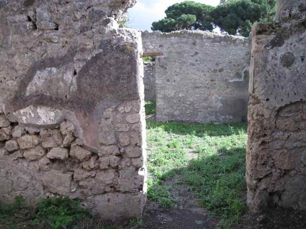 I.2.22 Pompeii. September 2010. Room 4, doorway in south wall, looking into shop. Photo courtesy of Drew Baker.
