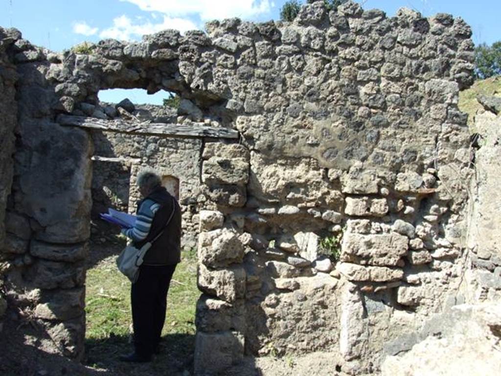 I.2.22 Pompeii.  March 2009.  Room 2.  North wall, with door leading into Shop.