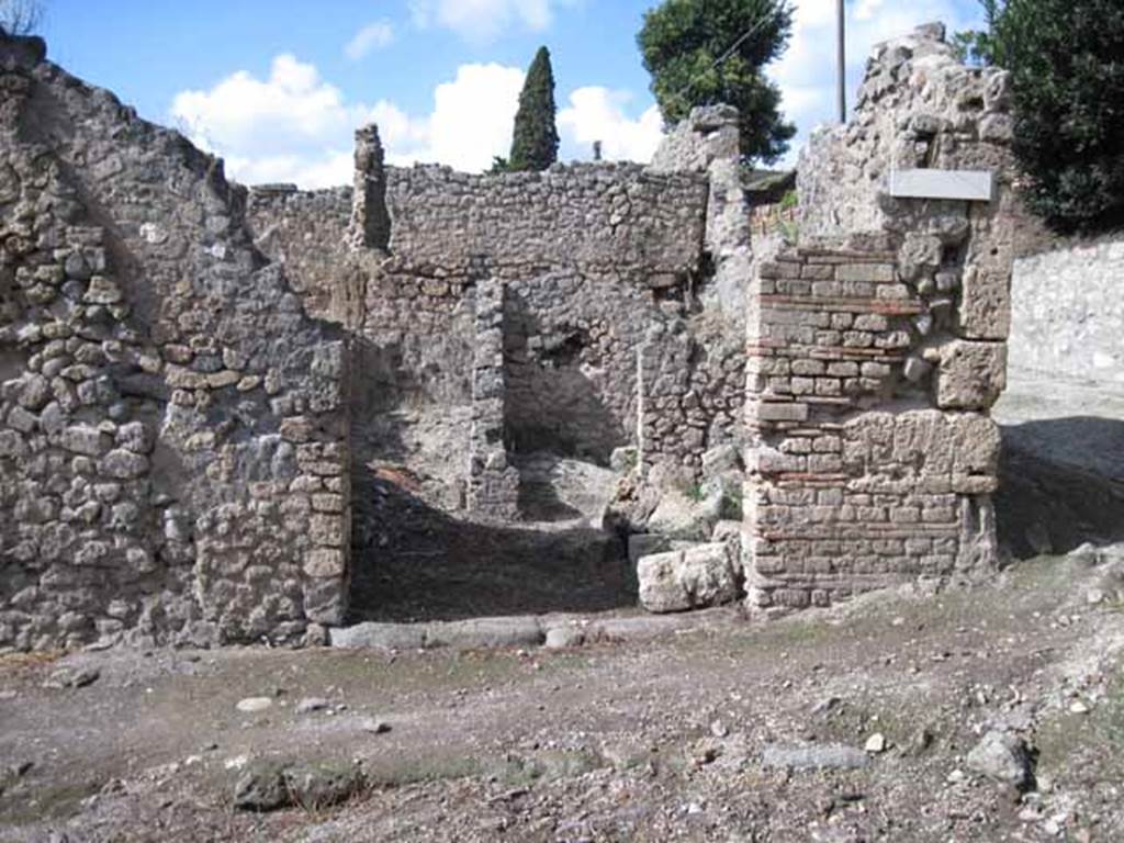 I.2.23 Pompeii. September 2010. Looking north to entrance doorway, from across Vicolo del Conciapelle. Photo courtesy of Drew Baker.
