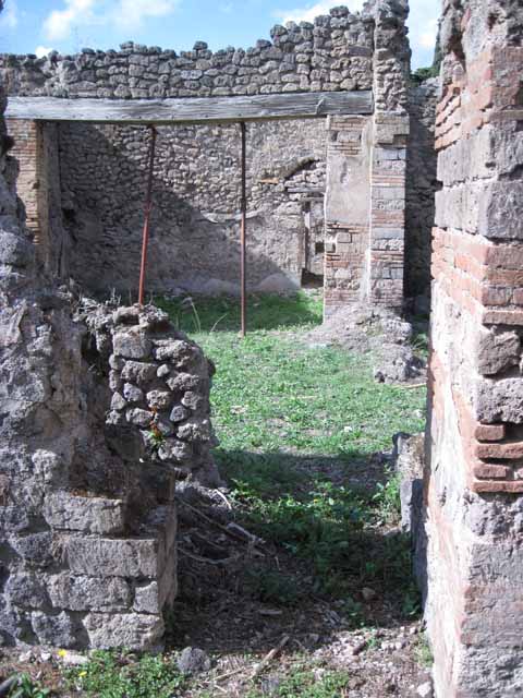 I.2.24 Pompeii. September 2010. North wall and north-west corner of large room. Photo courtesy of Drew Baker.
