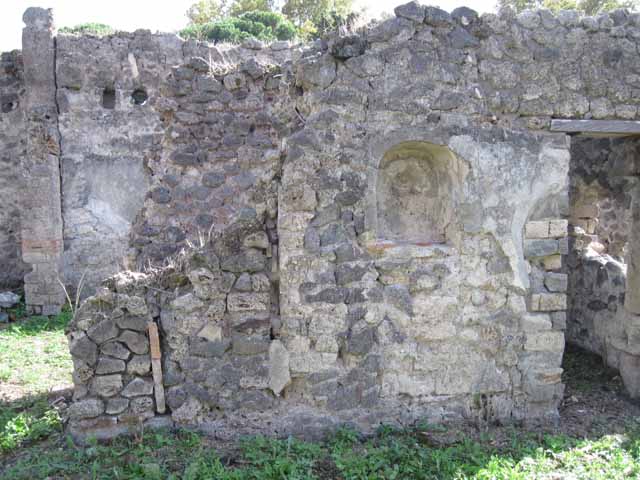 I.2.24 Pompeii. September 2018. 
Looking towards east half of south wall of atrium, with niche. The stairs are behind the wall on the left. Photo courtesy of Aude Durand.
