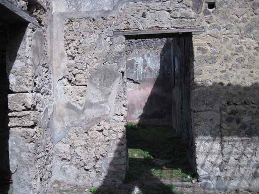 I.2.28 Pompeii. September 2010. Looking east to doorway to corridor and room in east wall of atrium, in north-east corner. Photo courtesy of Drew Baker.
