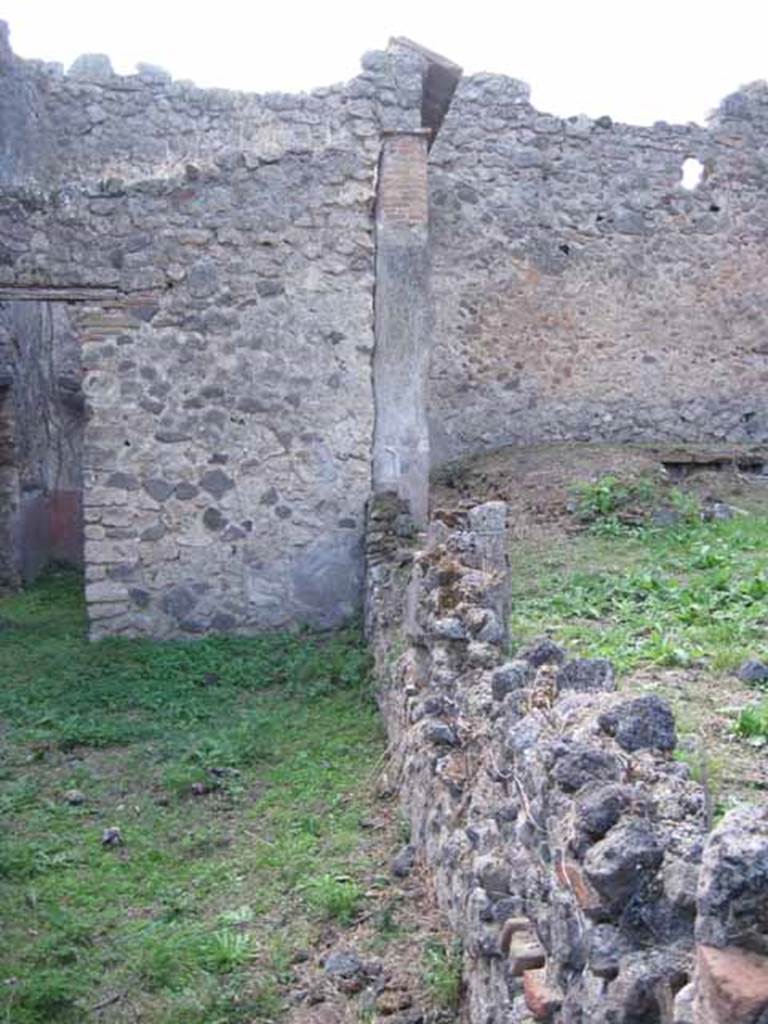 I.2.28 Pompeii. September 2010. Looking west along south portico garden wall. Photo courtesy of Drew Baker.  According to Jashemski, this originally would have been the site of an entrance through the wall into the garden.
