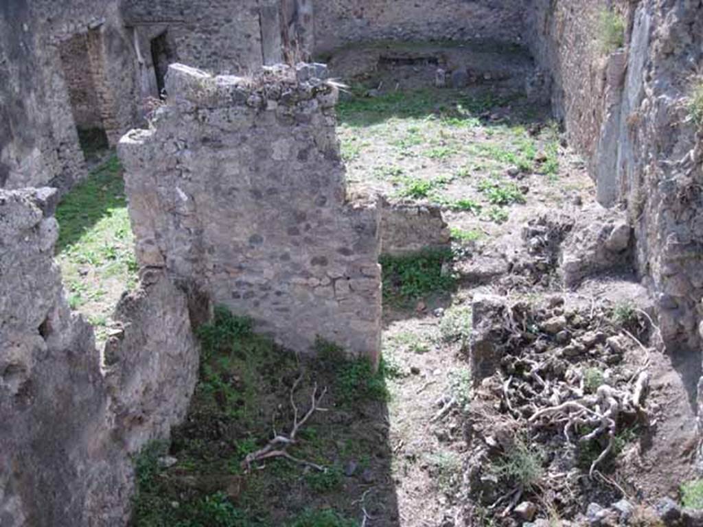 I.2.20 Pompeii. September 2010. Looking west into kitchen area below I.2.20, and across towards garden. In the lower right can be seen, the site of the first small room on the north side of the kitchen. On the west side of the room can be seen the remains of the steps to the upper floor. In the centre right, in the peristyle wall, can be seen another entrance into the peristyle garden. Photo courtesy of Drew Baker.

