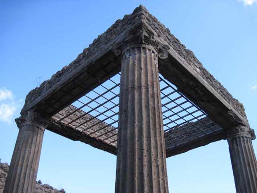 I.2.28 Pompeii. September 2010. View of the atrium columns from the north-west column corner of the atrium.  Photo courtesy of Drew Baker.
According to Fiorelli, the tetrastile atrium had a compluvium made of grating to stop anyone entering the house. See Pappalardo, U., 2001. La Descrizione di Pompei per Giuseppe Fiorelli (1875). Napoli: Massa Editore. (p. 37)
