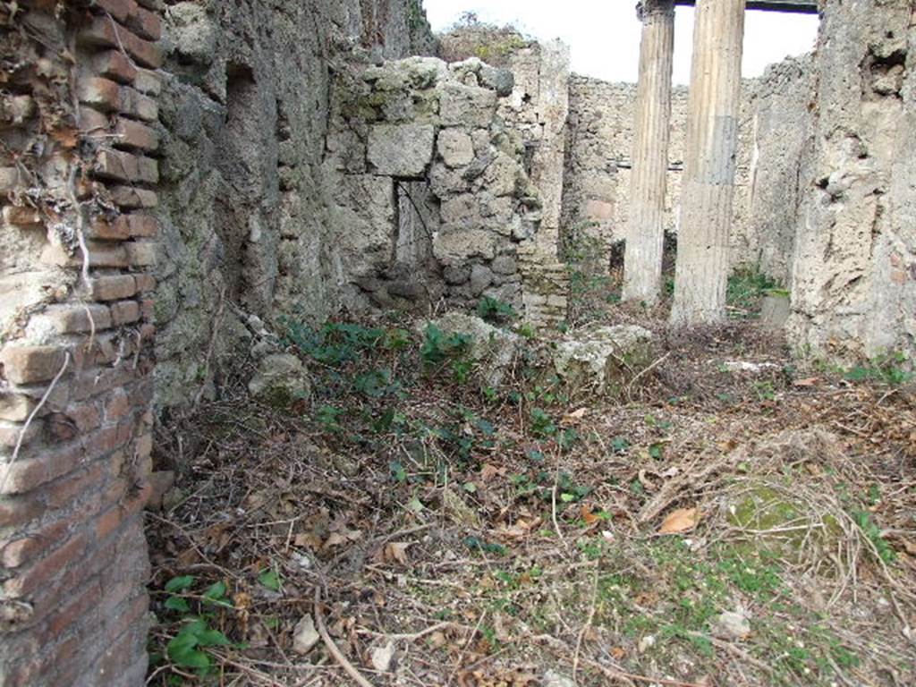 I.2.29 Pompeii. December 2006. West side with the site of the remains of the counter and hearth.