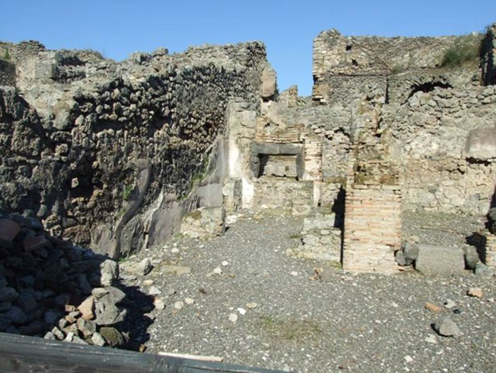 I.3.1 Pompeii. March 2009.  North side of bakery shop, with site of steps to upper floor and oven in north east corner.