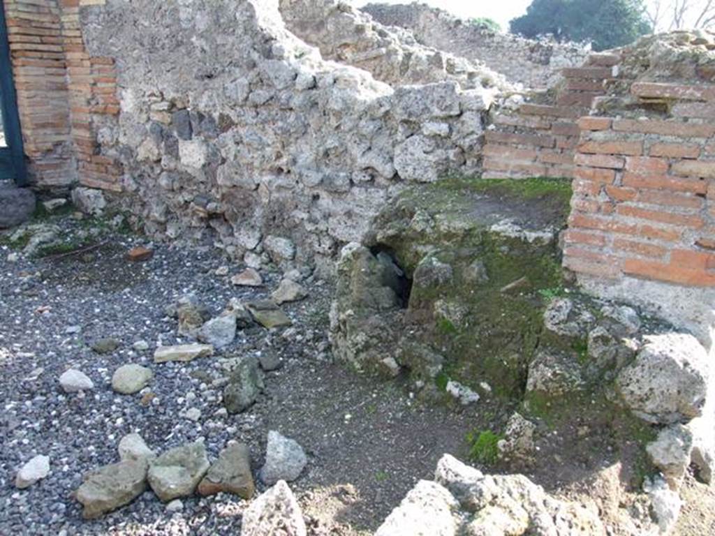 I.3.4 Pompeii. December 2007. South wall and stone base of staircase in south-west corner at front of shop.